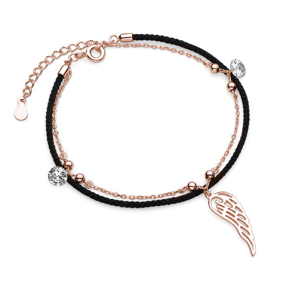 Rosa forgyldt armbånd med sort snor, vinge og zirkoner Rosa forgyldt armbånd med sort snor, vinge og zirkoner